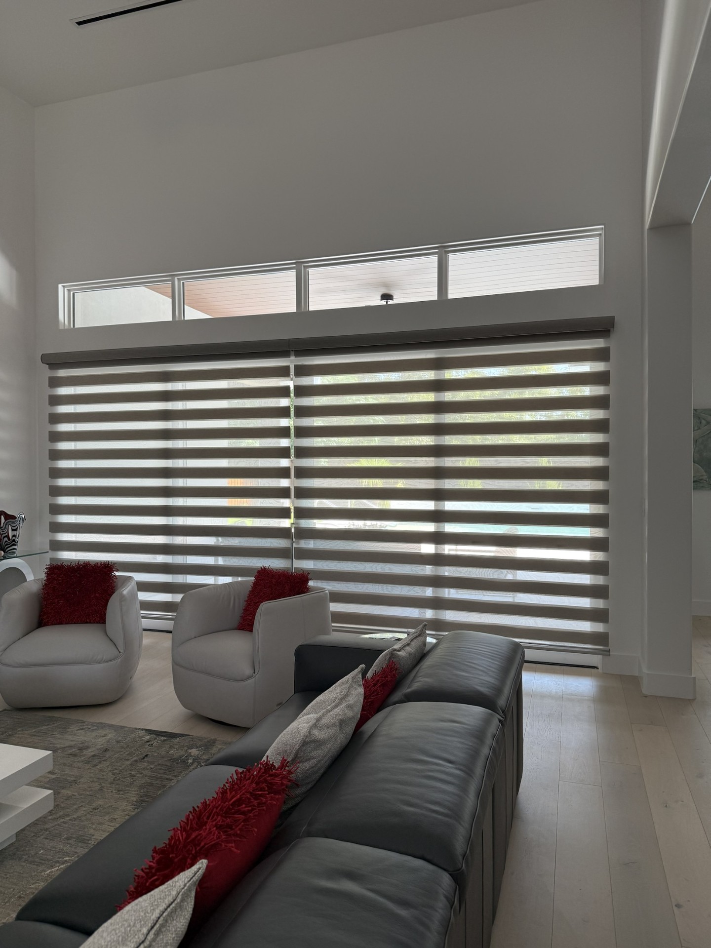 Sunlit living room with custom zebra shades