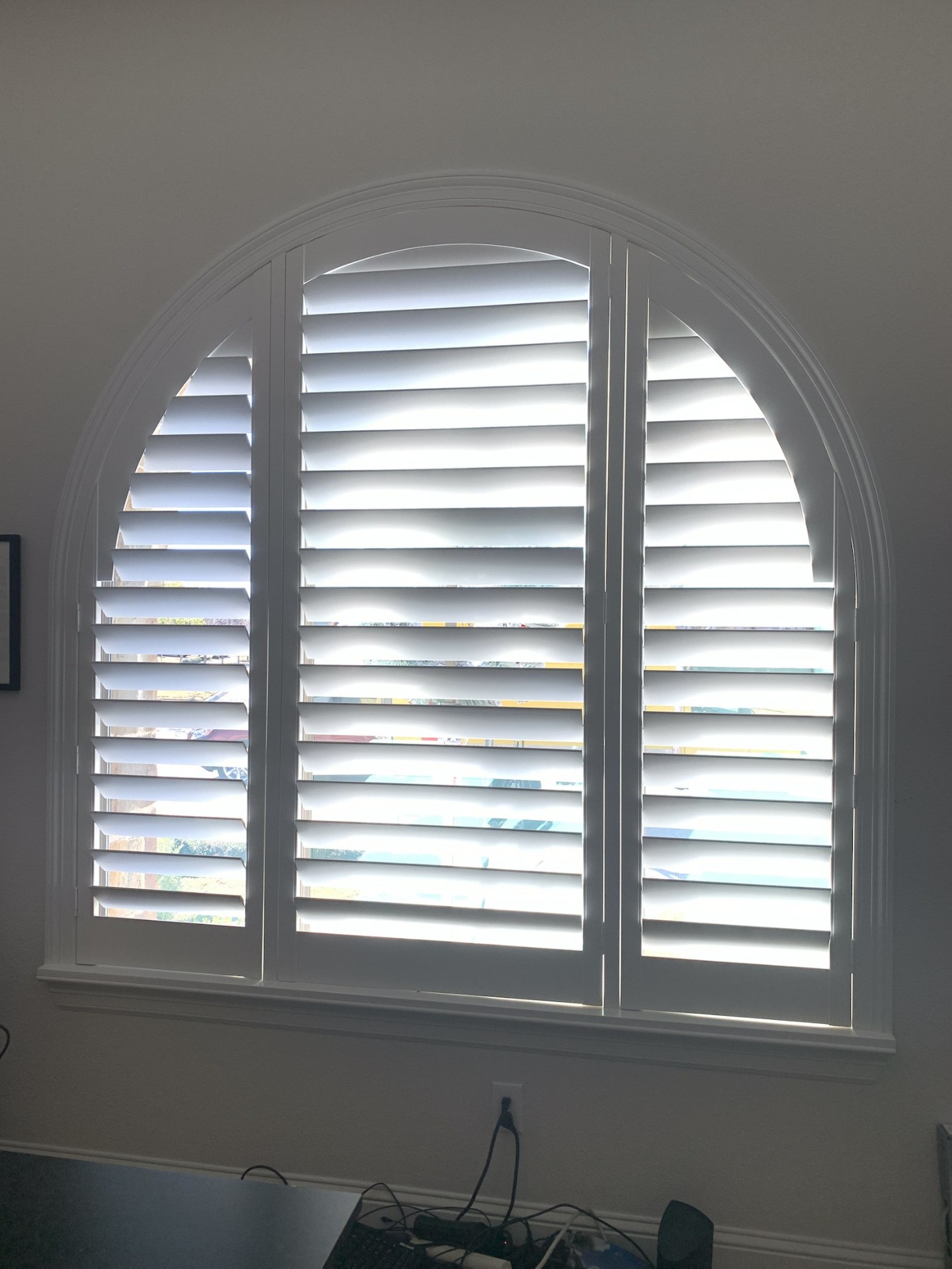 Plantation shutters in bright room